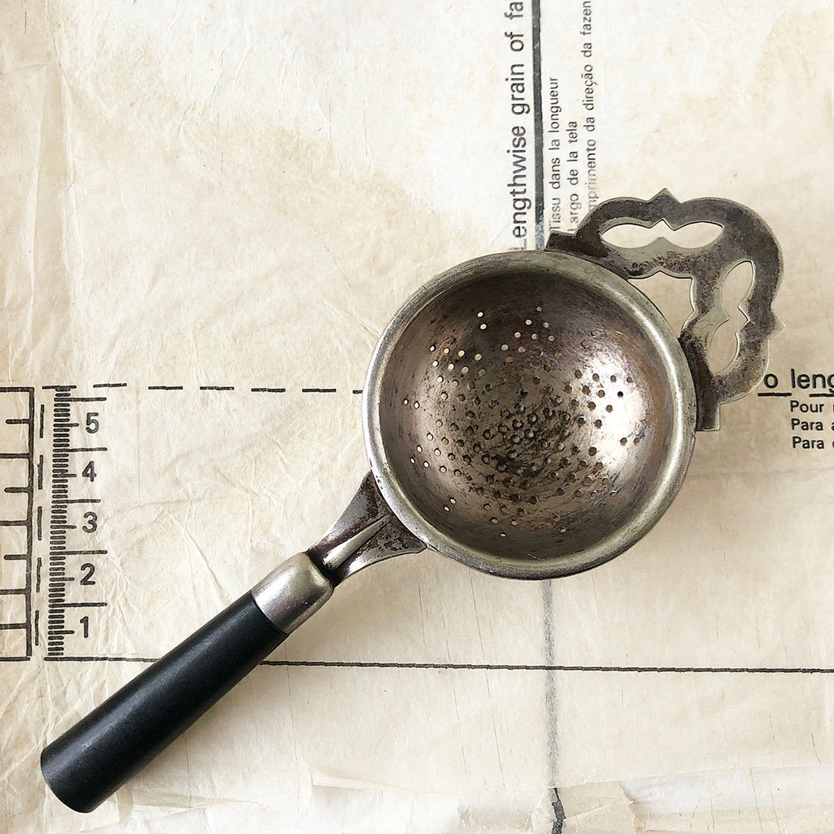Vintage Silver Plated Tea Strainer with Black handle at Ten Green Balloons Marketplace